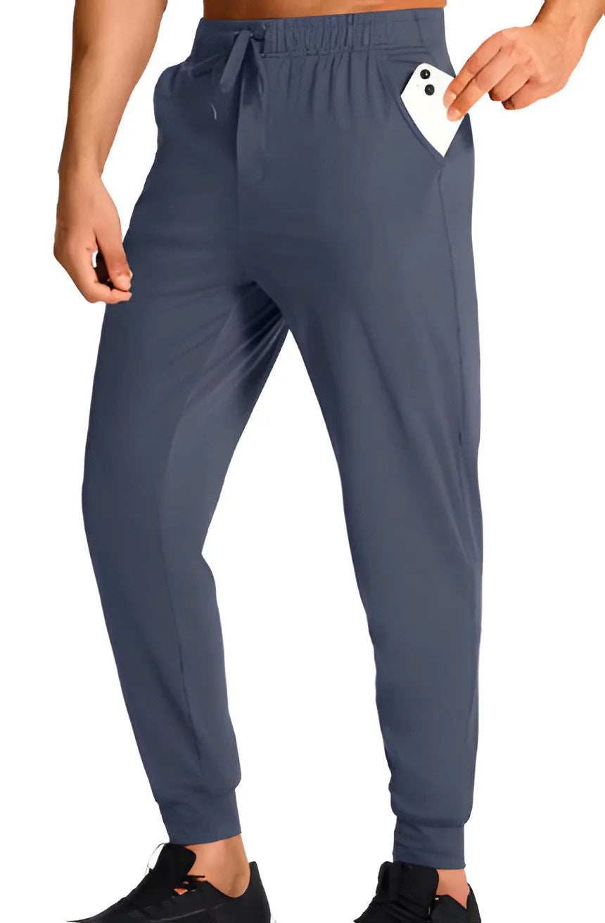 Men's loose fit casual polyester trousers in a solid colour, shown on a hanger.