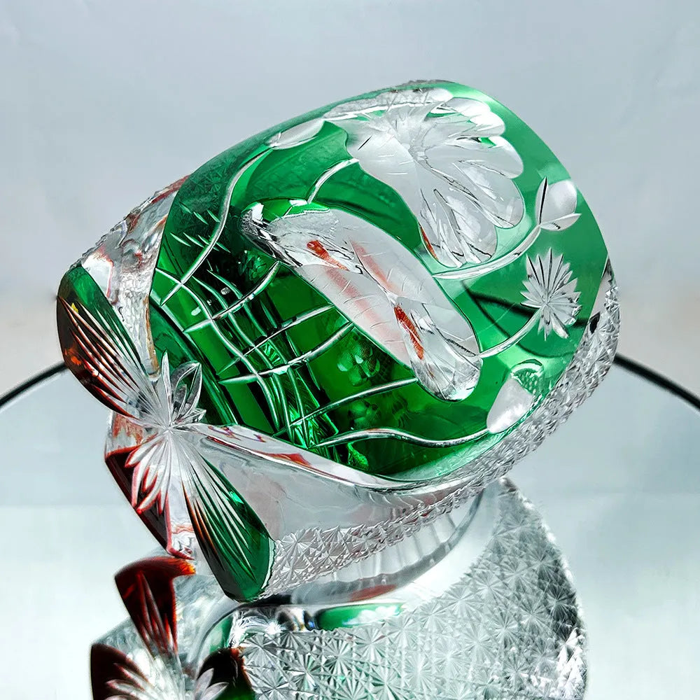 Edo crystal glass whiskey shot glass with carved cylindrical pattern in assorted yellow green