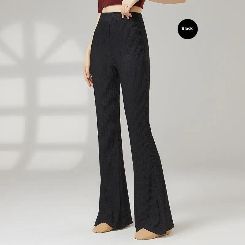Women's solid colour dance practice pants in stretch polyester fabric on a hanger.