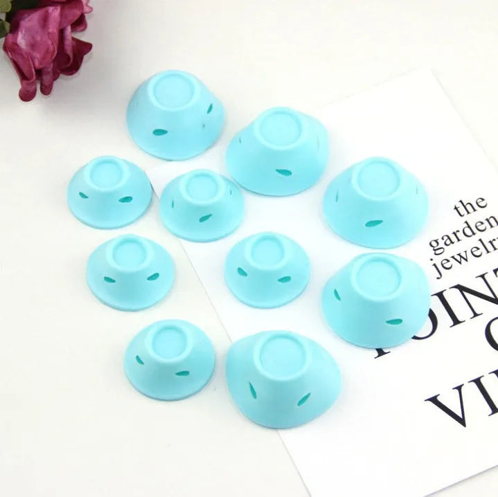 Set of ten soft silicone hair rollers in pink, blue, purple, and black, large 5cm and small 3.9cm diameter