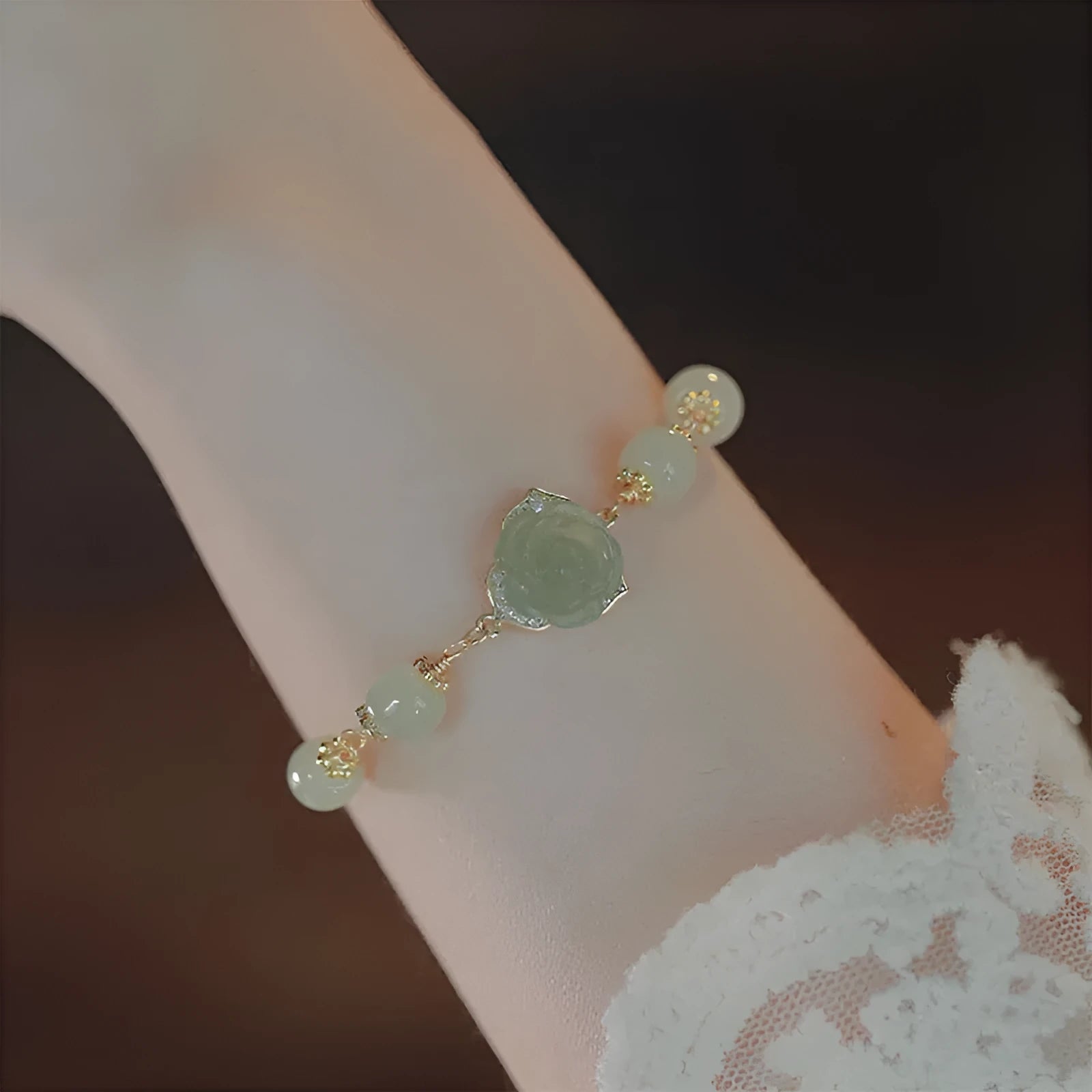 Original design women's bracelet in Hetian jade rose with 14K gilding and a flower shape.