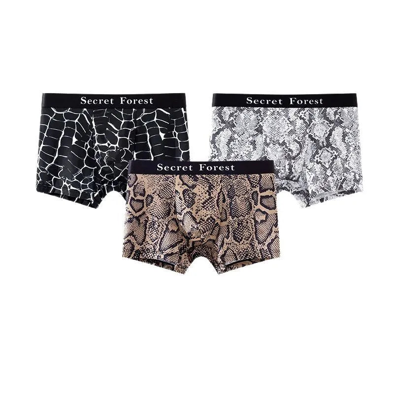 Men's thin loose knitted polyester boxer shorts in black, grey, and brown colours on a mid-waist model.