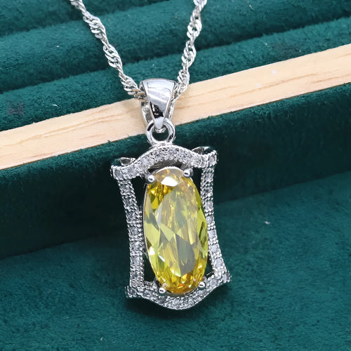 Yellow and olive alloy zircon jewellery set for women showing necklace, earrings, ring, and bracelet on display.