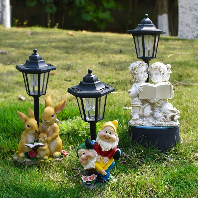 Solar powered resin garden lamp with decorative animal character design for outdoor lighting