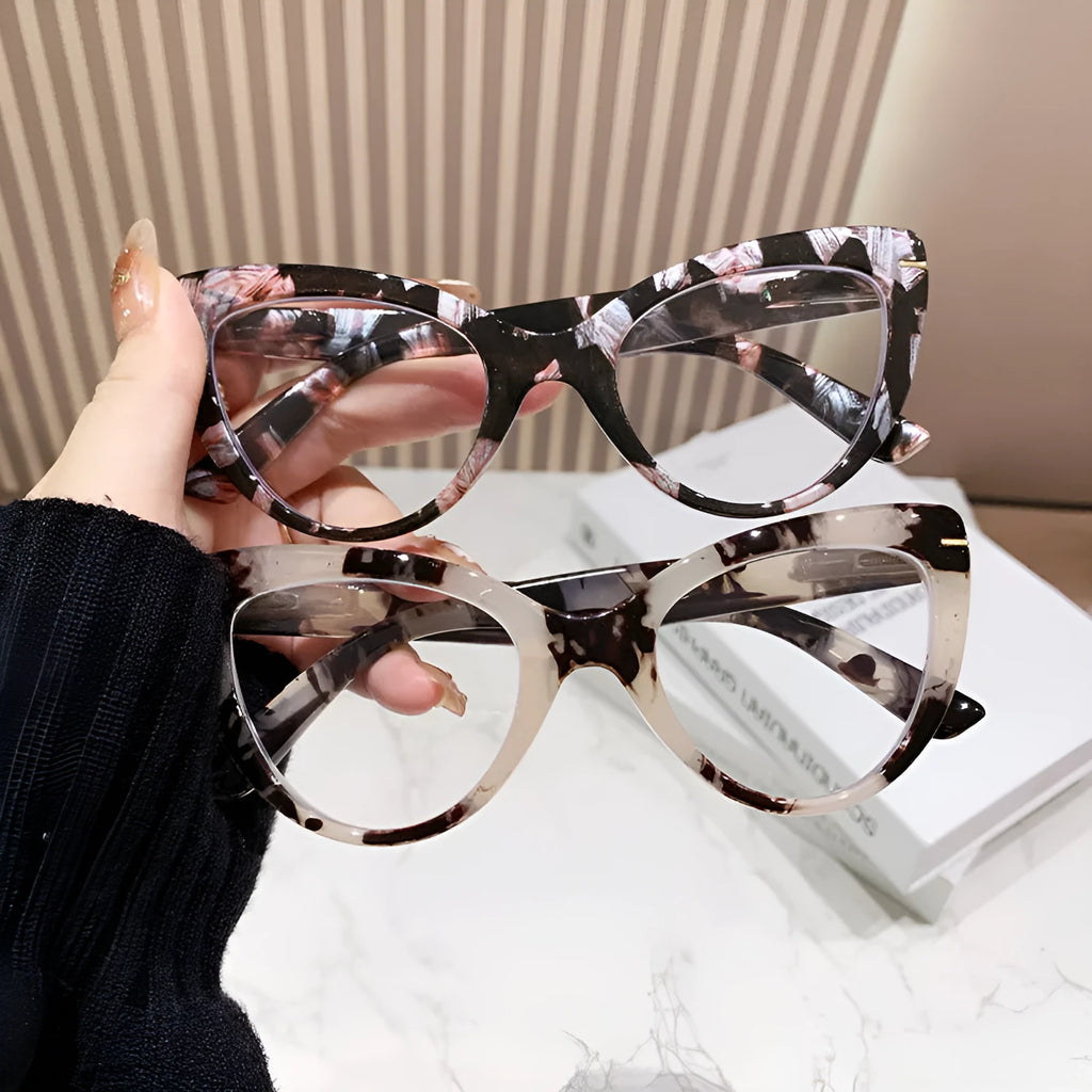Women's cat eye reading glasses with large frames showing dragon and phoenix decorations