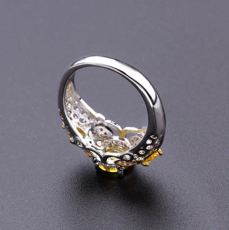 Geometric alloy ring with simulated zircon centre, available in sizes 6-10