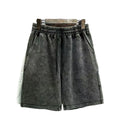 Men's charcoal black cotton shorts with a distressed style and loose straight-leg fit