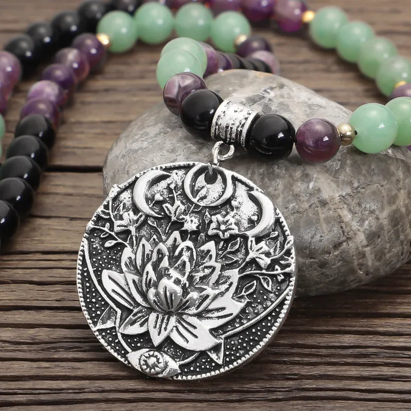 Dongling Long adjustable stone bead necklace with alloy lotus pendant and matching bracelet.