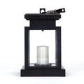 Solar LED candle light with black plastic shade, monocrystalline silicon panel, and IP44 waterproof rating for outdoor garden use