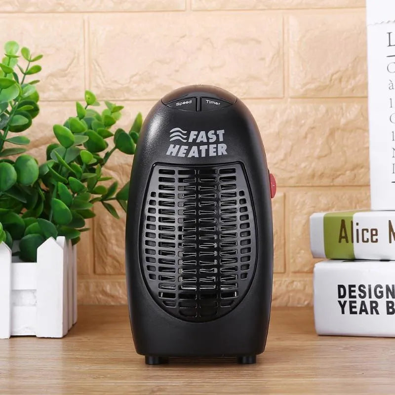 Black mini ceramic electric heater with digital display and a rotating plug on a white background.