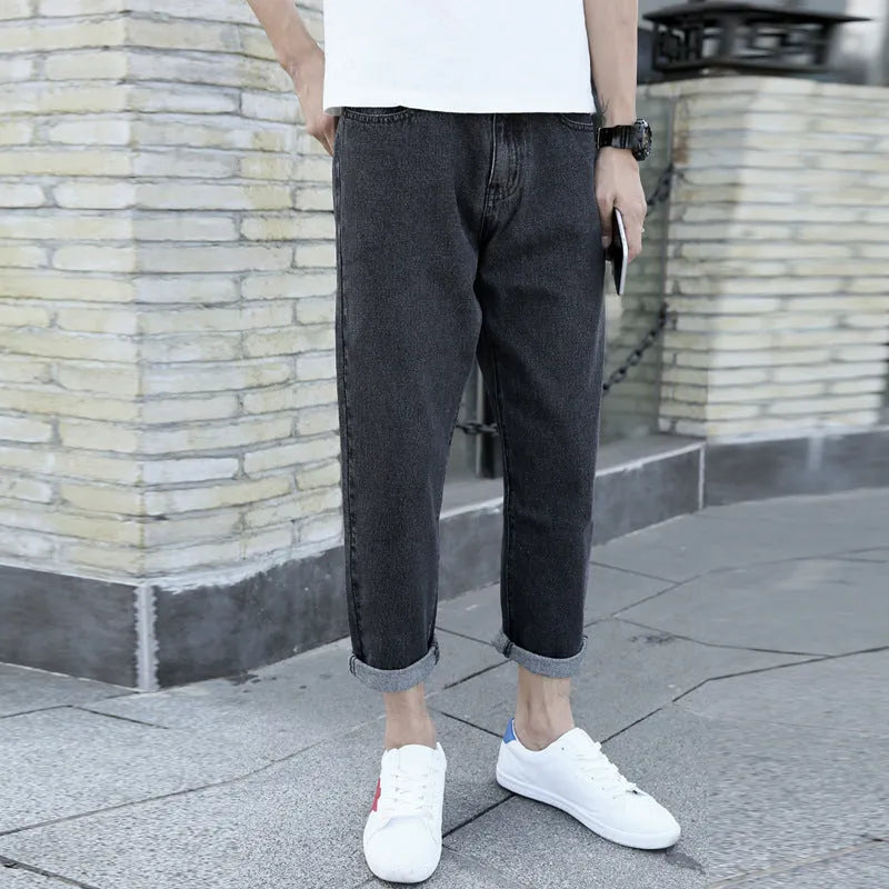 Men's black loose straight fit harem jeans with lightweight straight leg opening