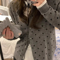 Women's grey dot pattern knitted cardigan with long sleeves and crocheted flower details