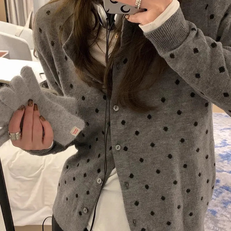Women's grey dot pattern knitted cardigan with long sleeves and crocheted flower details