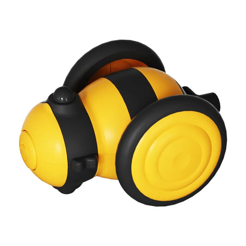 Pink and yellow bee-themed electric cat toy with feather attachment on floor