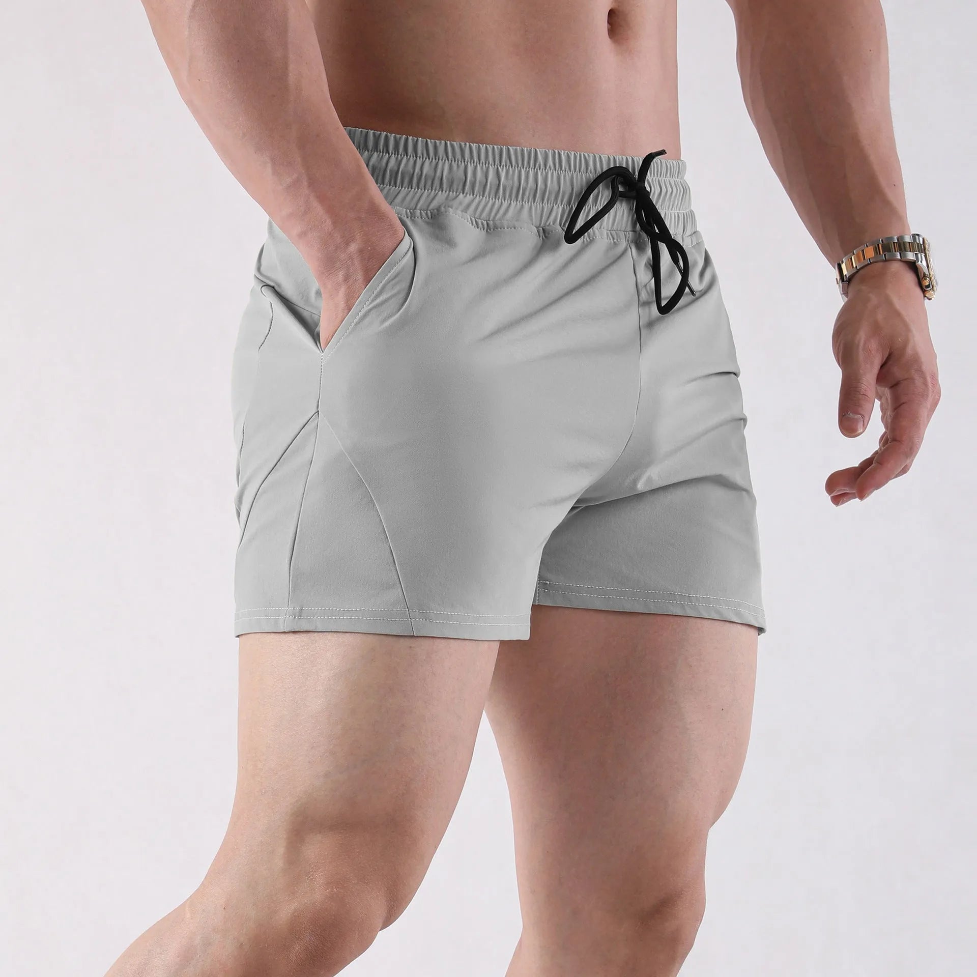 Men's thin grey basketball shorts made from polyester with an elastic waistband.