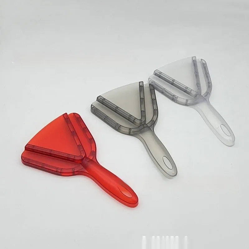 Red telescopic bottle opener with non-slip jaws, shown extended on a kitchen counter.