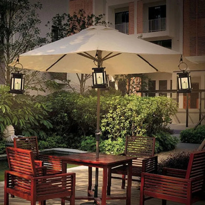 Solar LED candle light with black plastic shade, monocrystalline silicon panel, and IP44 waterproof rating for outdoor garden use