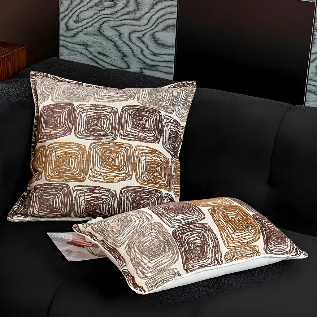 Square cream and coffee-coloured abstract coil pattern pillow cover, 50cm by 50cm.