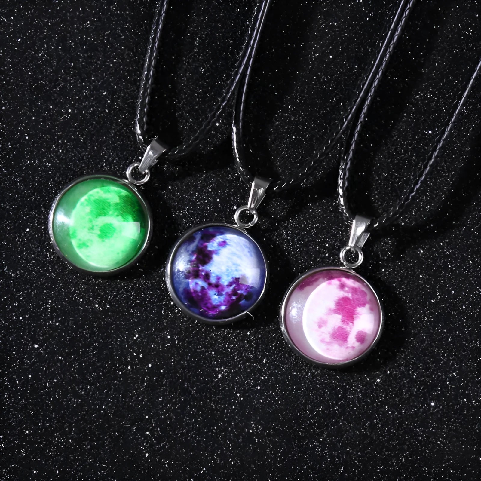 Luminous moon and constellation night sky pendant on an extendable alloy necklace chain.