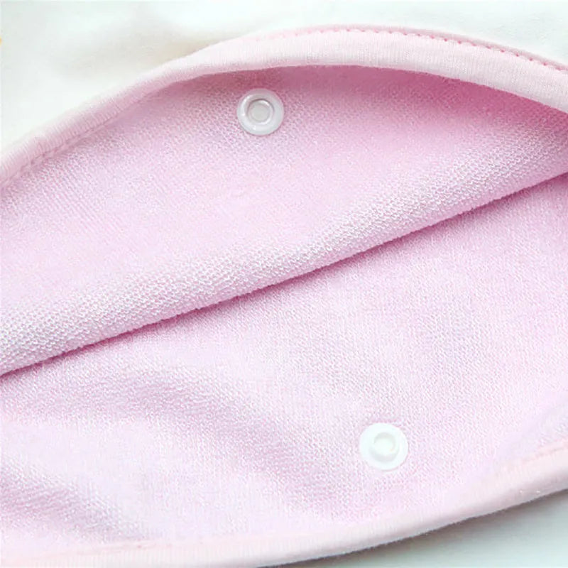 Baby girl wearing a multi-colour waterproof cotton diaper skirt with elastic waistband for belly protection