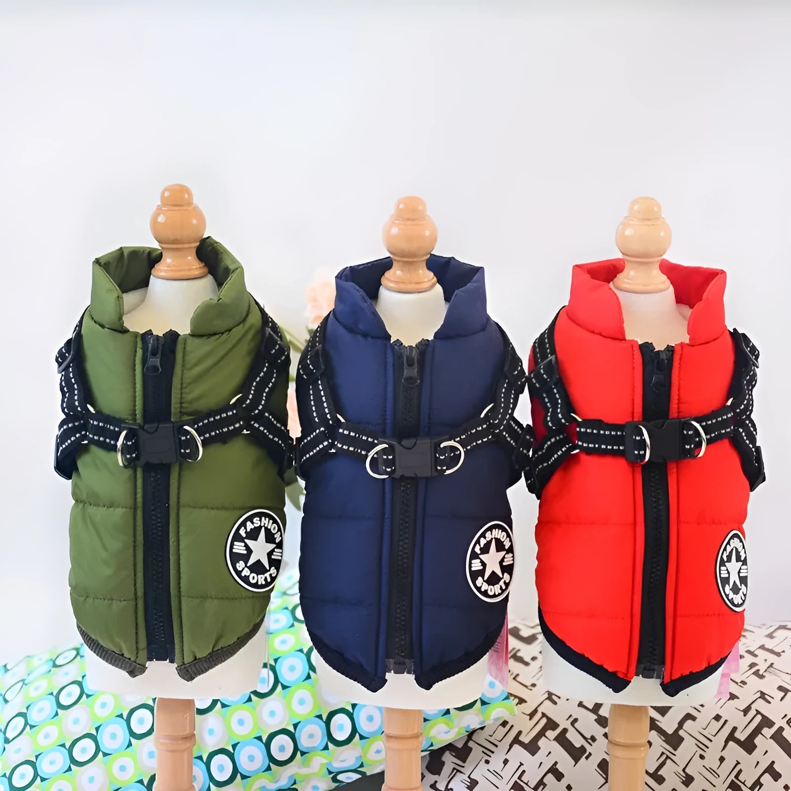 Waterproof dog coat with integrated harness in red, navy blue, or army green, shown on a dog.