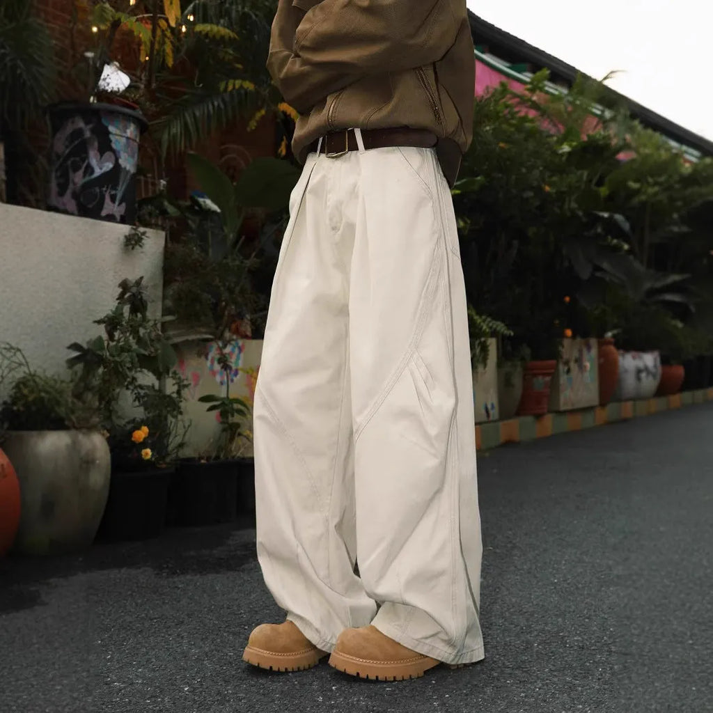 Men's straight-cut cotton trousers in black, brown, and apricot colours with striped pattern and pleated detailing