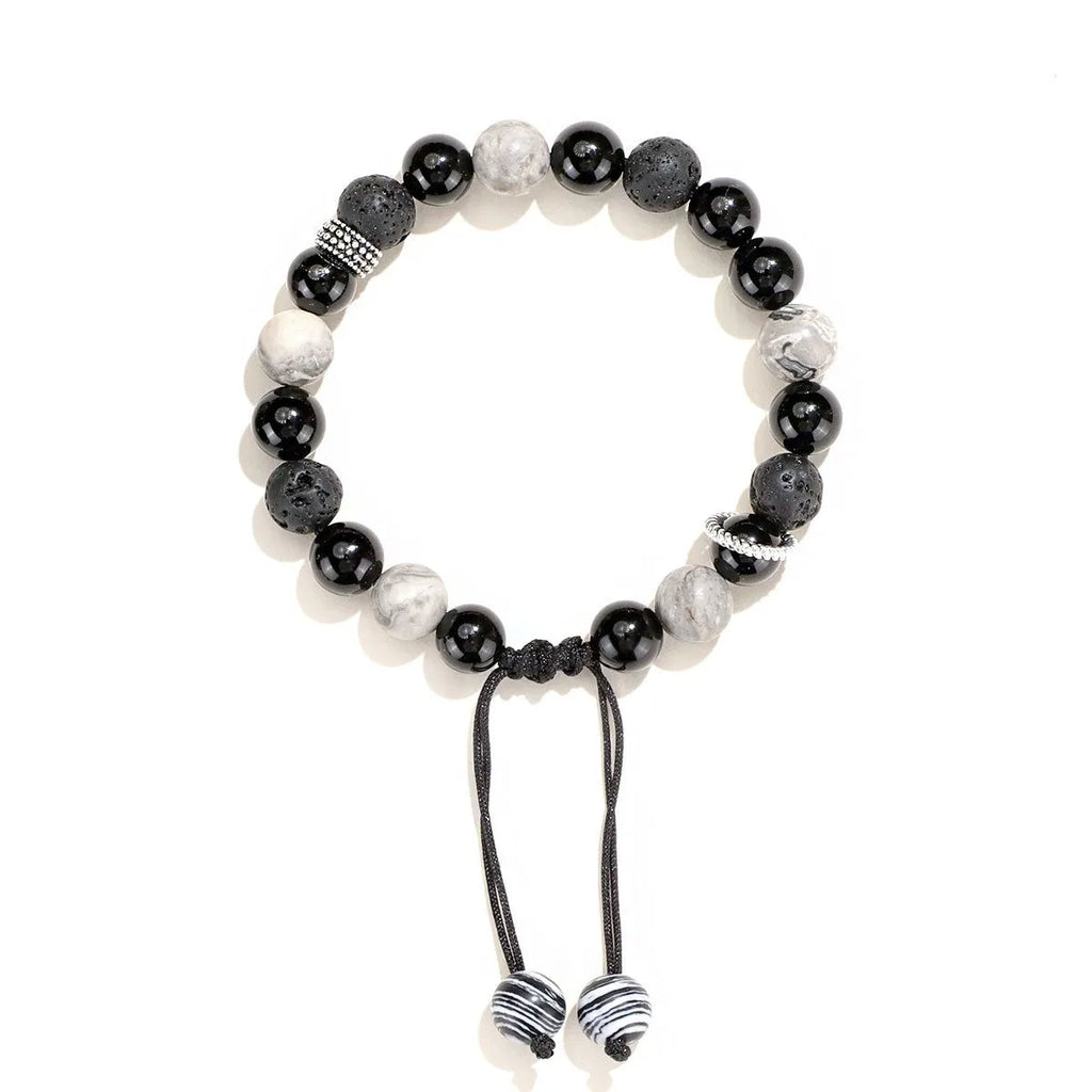 Black agate volcanic rock bracelet with diamond-cut facets, shown in two width sizes.