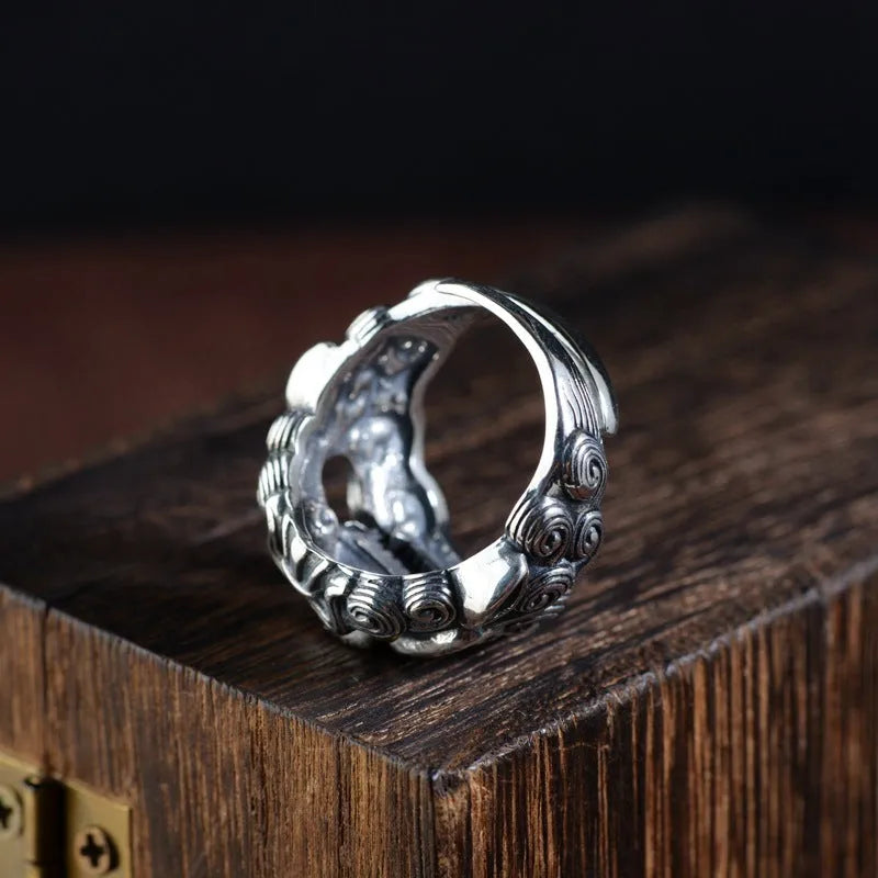 Silver open ring with detailed jibeast animal zodiac pattern showing adjustable retro design