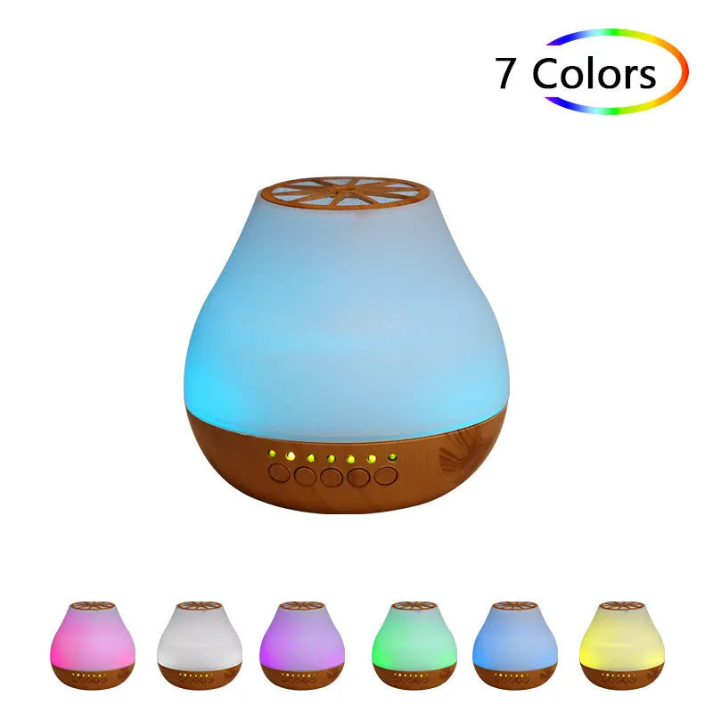 USB ultrasonic aroma diffuser with wood grain finish and colourful light on a wooden desk