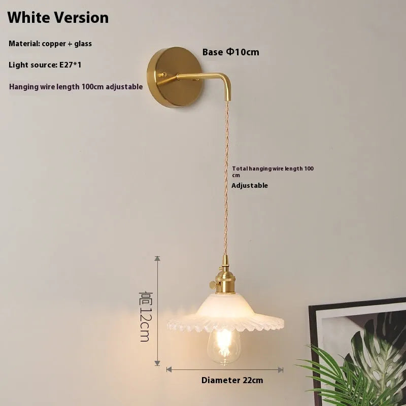 Retro brass wall lamp with a glass lotus shade in a choice of six colours on a copper base.