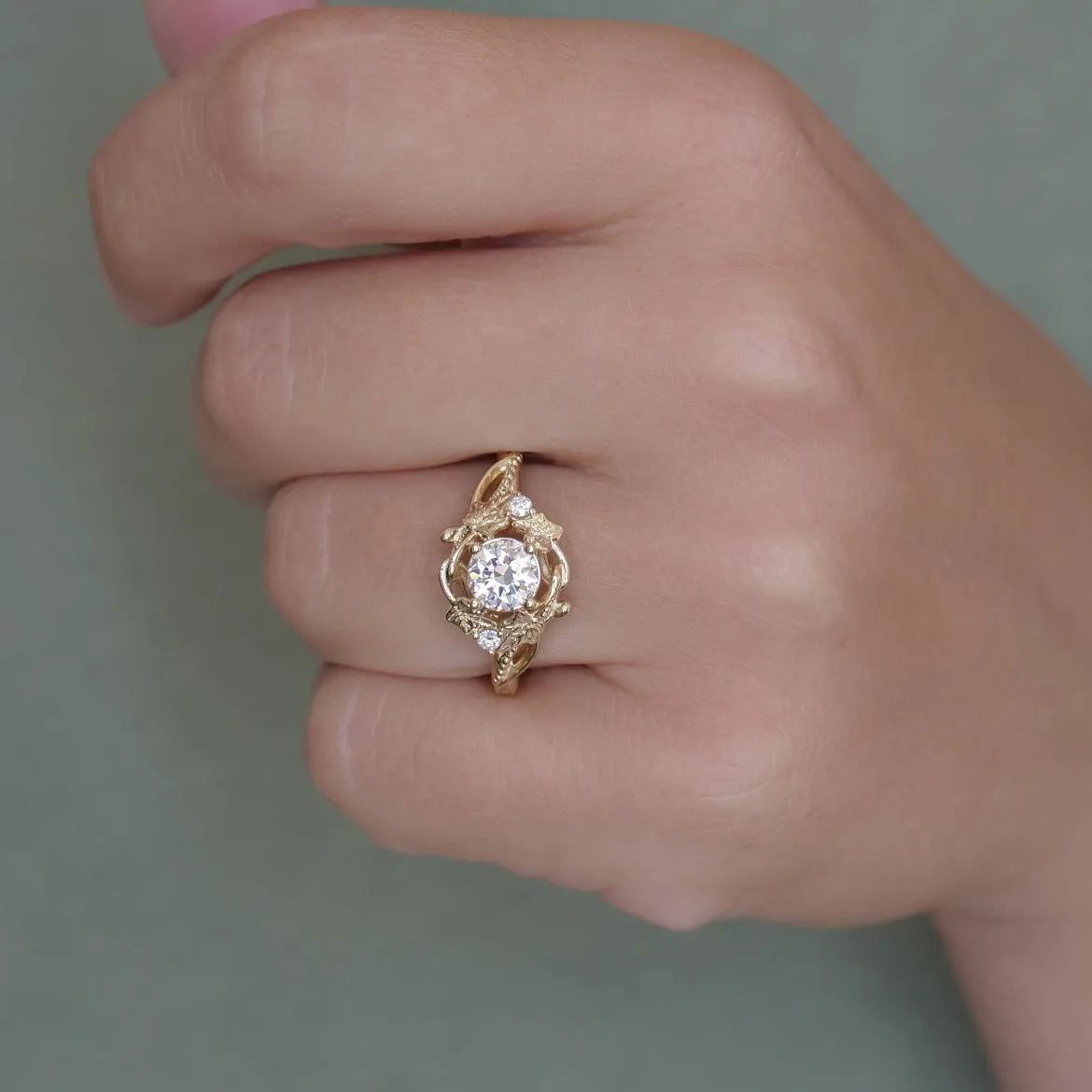 Gold alloy ring with brushed finish on neutral background
