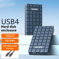 Silver aluminium USB4 hard drive enclosure for M.2 NVMe SSDs on a desk.