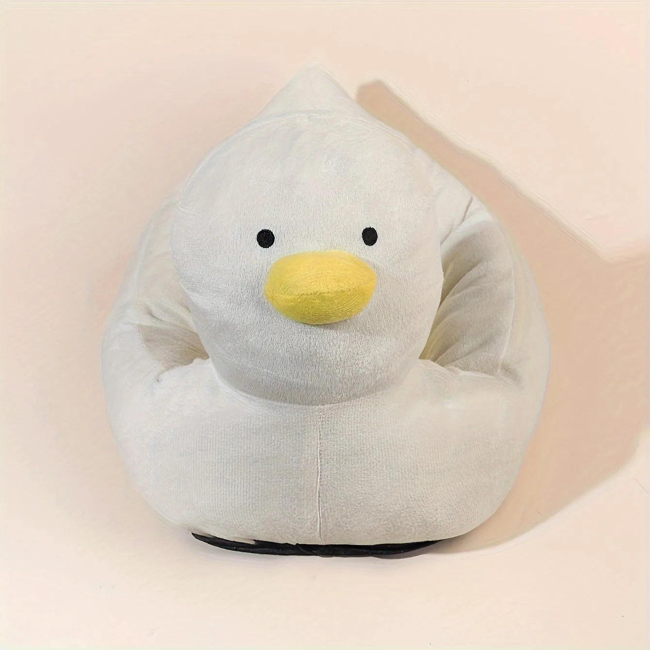 Blue duck-shaped fluffy pet bed for small dogs and cats on a floor