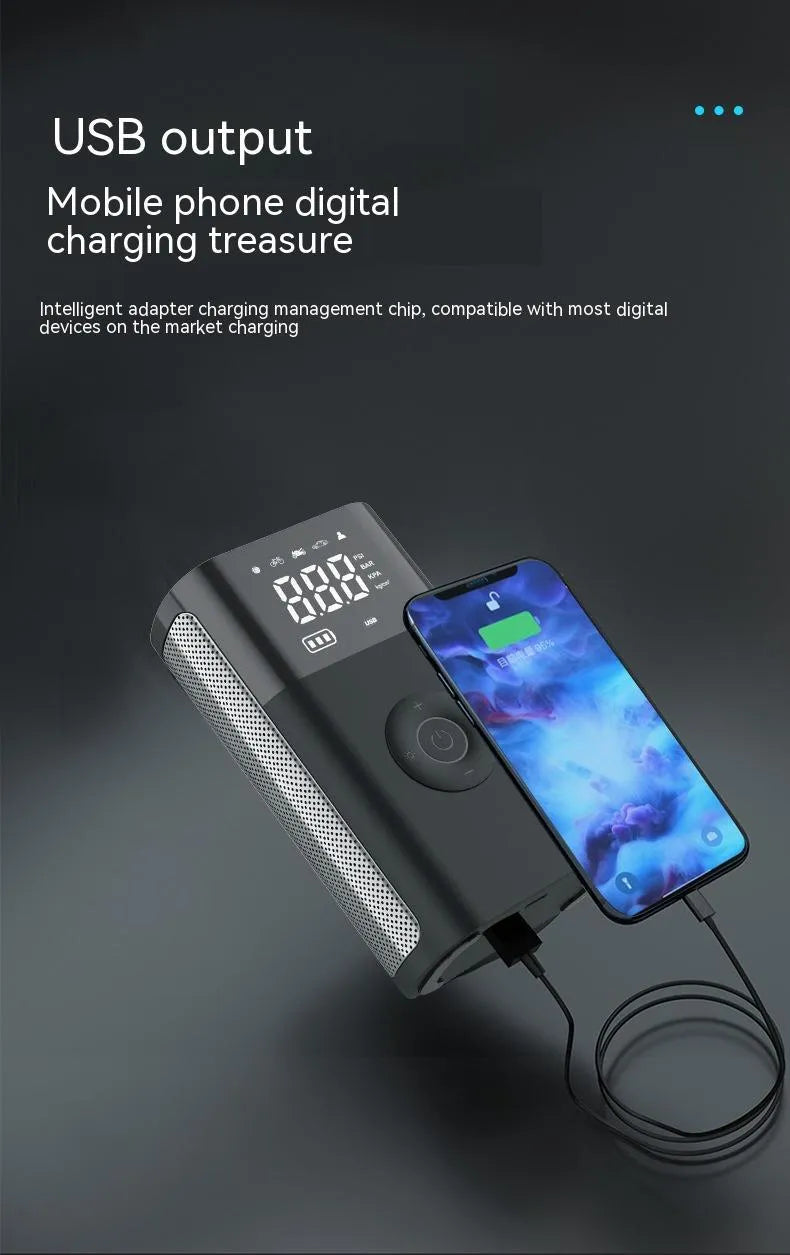 Handheld wireless digital tyre inflator with display screen, LED light, and multiple nozzle adaptors on a table.