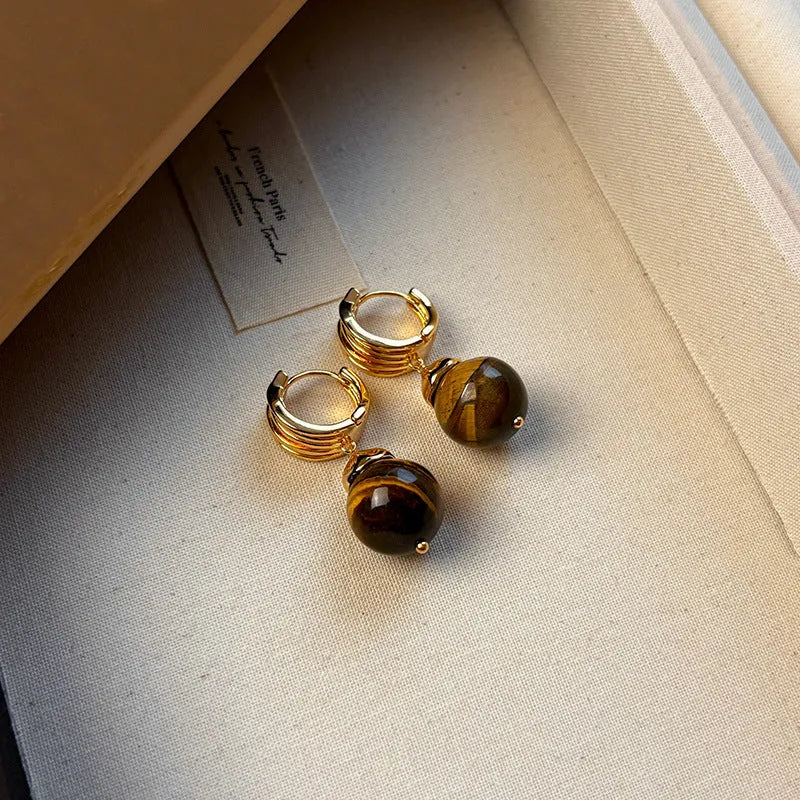 A pair of round geometric tigereye gemstone earrings with real gold plating in a French retro style.