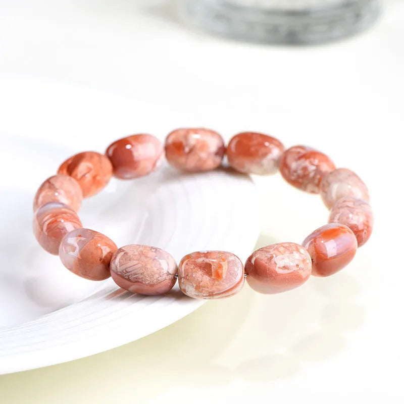 Natural cherry agate bracelet with barrel-shaped beads and Ruyi design element