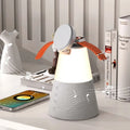 Grey 3-in-1 magnetic wireless charging Bluetooth speaker night light on a tabletop