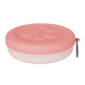 Portable dog food and water bowl showing separate compartments for outdoor feeding