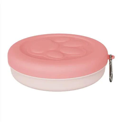 Portable dog food and water bowl showing separate compartments for outdoor feeding