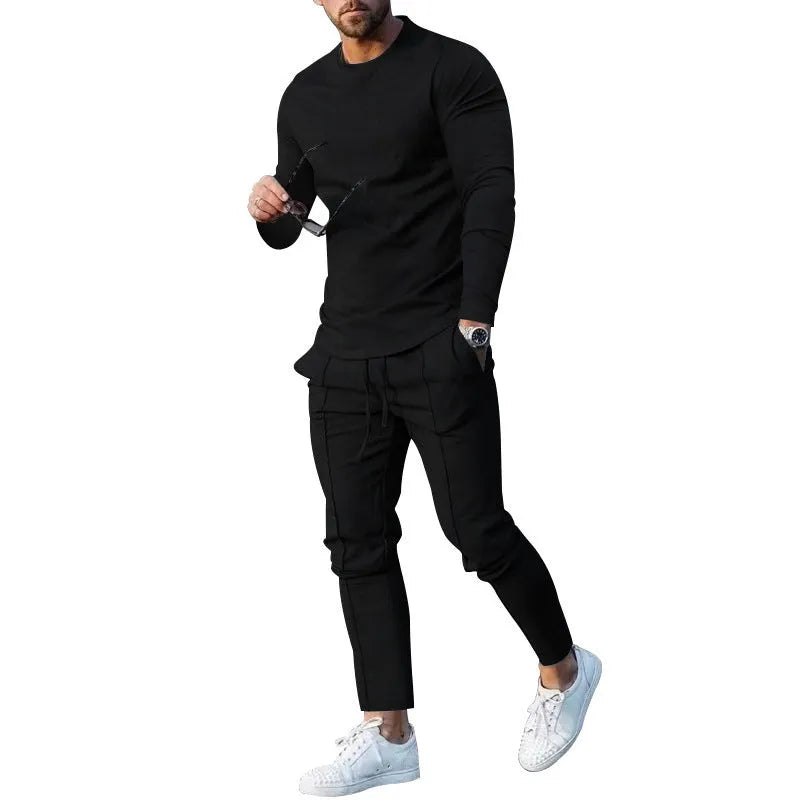 Men's light grey polyester two-piece suit with long sleeve t-shirt and trousers on a hanger.
