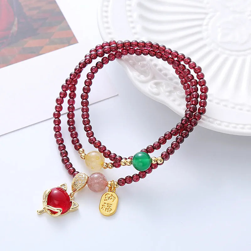 Purplish red garnet fox bracelet with adjustable rope tie for women