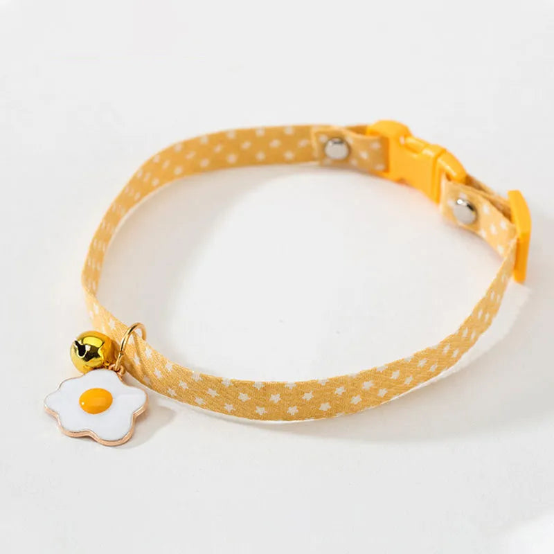 Small pet collar with bell pendant and decorative bow tie in adjustable design