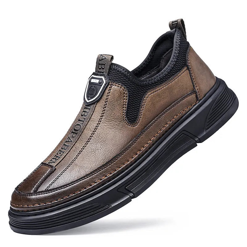 Men's black and brown casual leather shoes with round toe design shown from side view