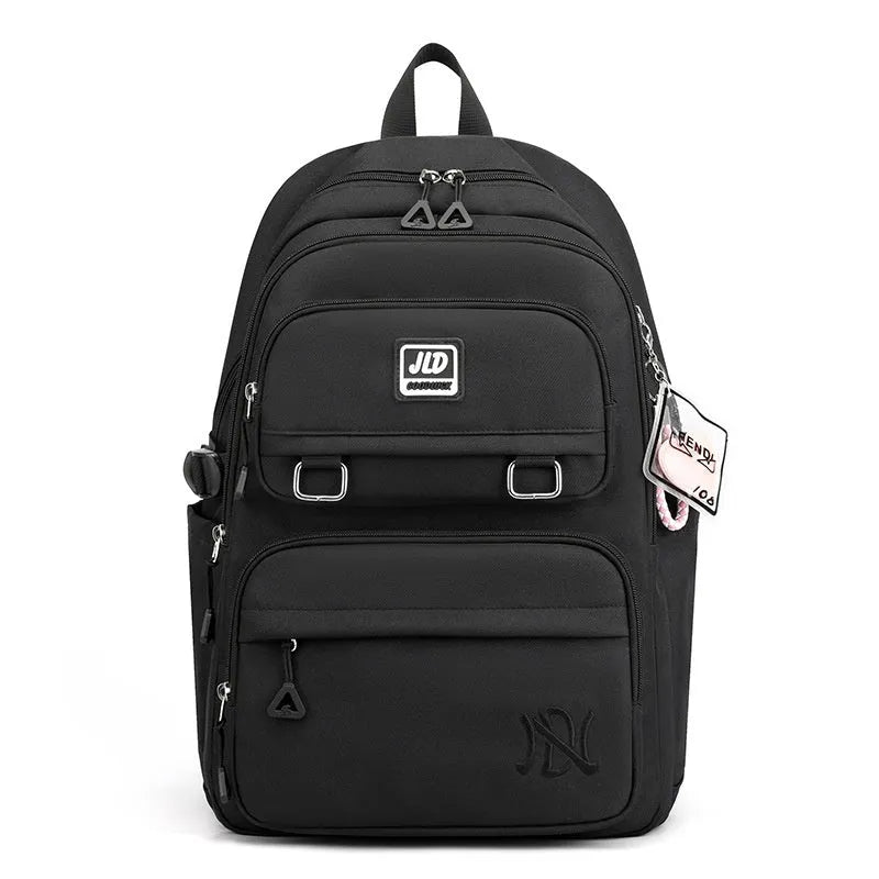Purple girls' large capacity nylon backpack with a physiological curve backplate for school use.