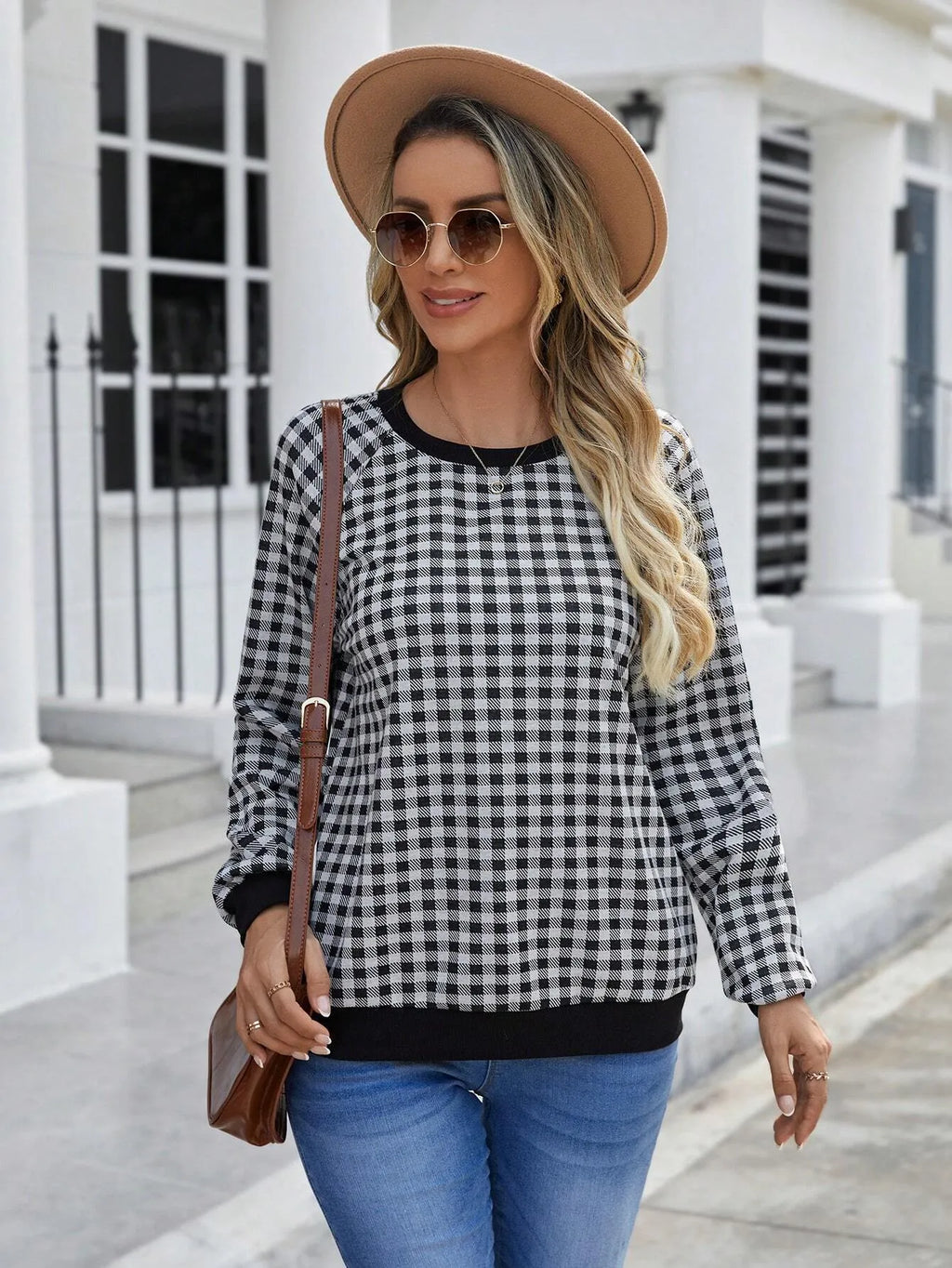 Black plaid striped long sleeve pullover sweater with printed design elements