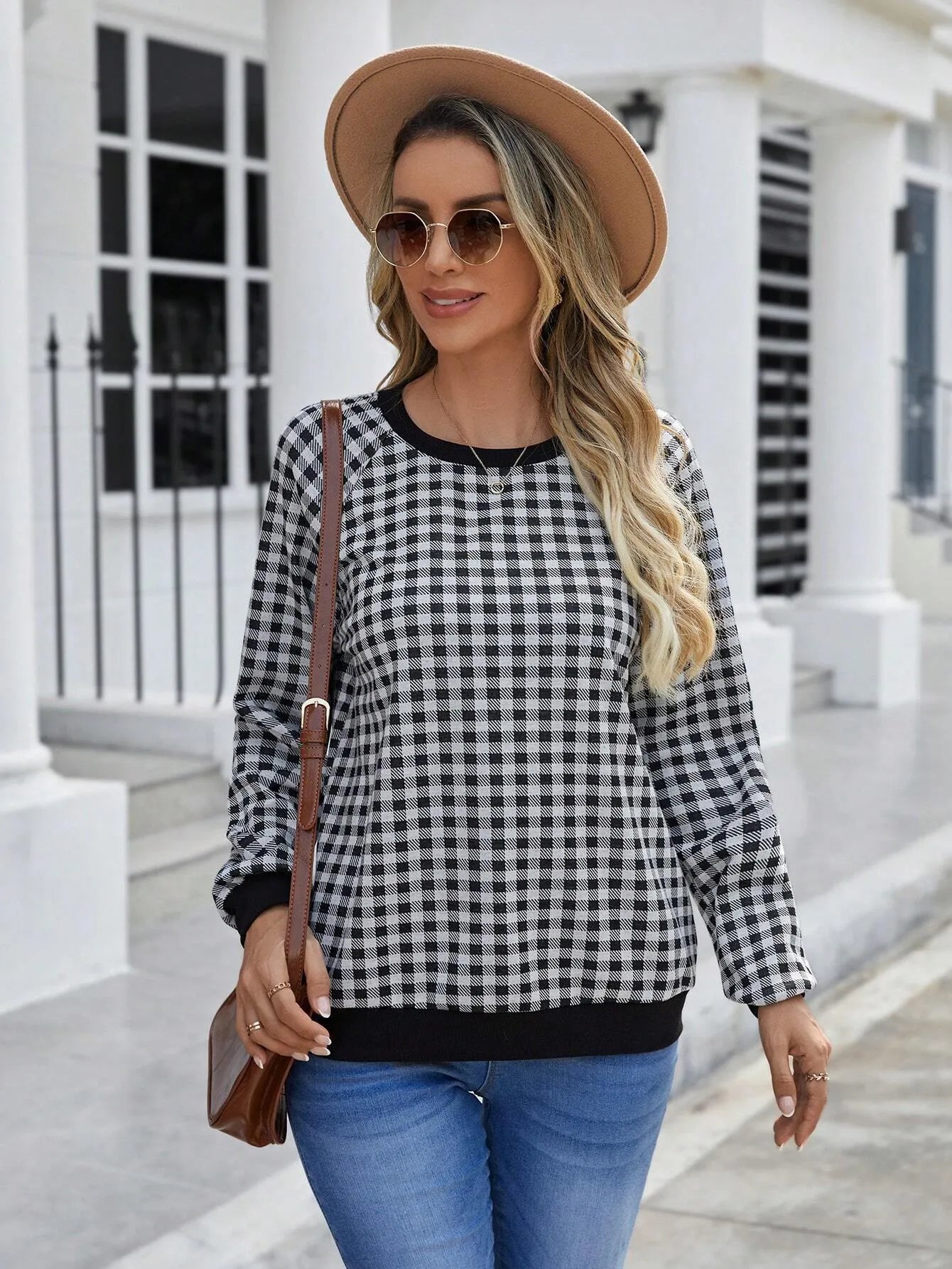 Black plaid striped long sleeve pullover sweater with printed design elements