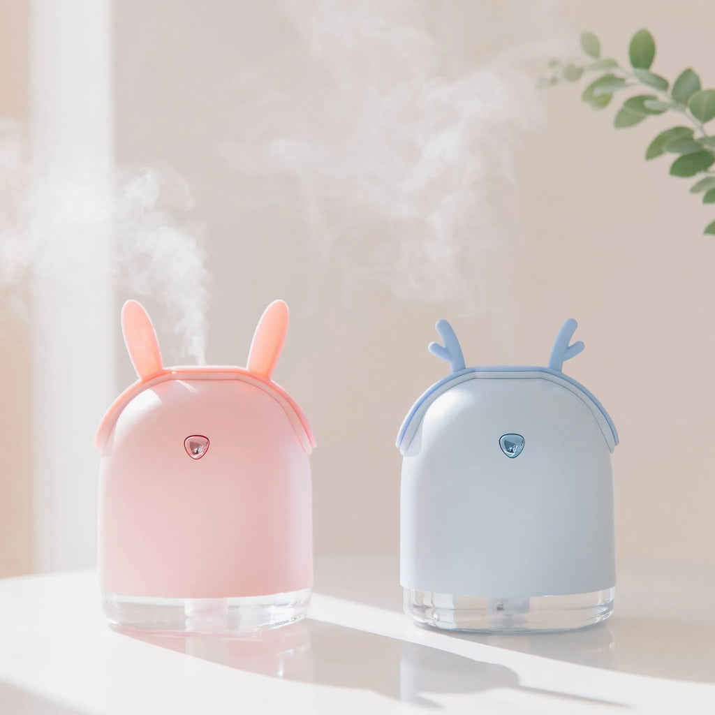 USB ultrasonic micron atomisation humidifier in pink, compact size, with single fog outlet and built-in light