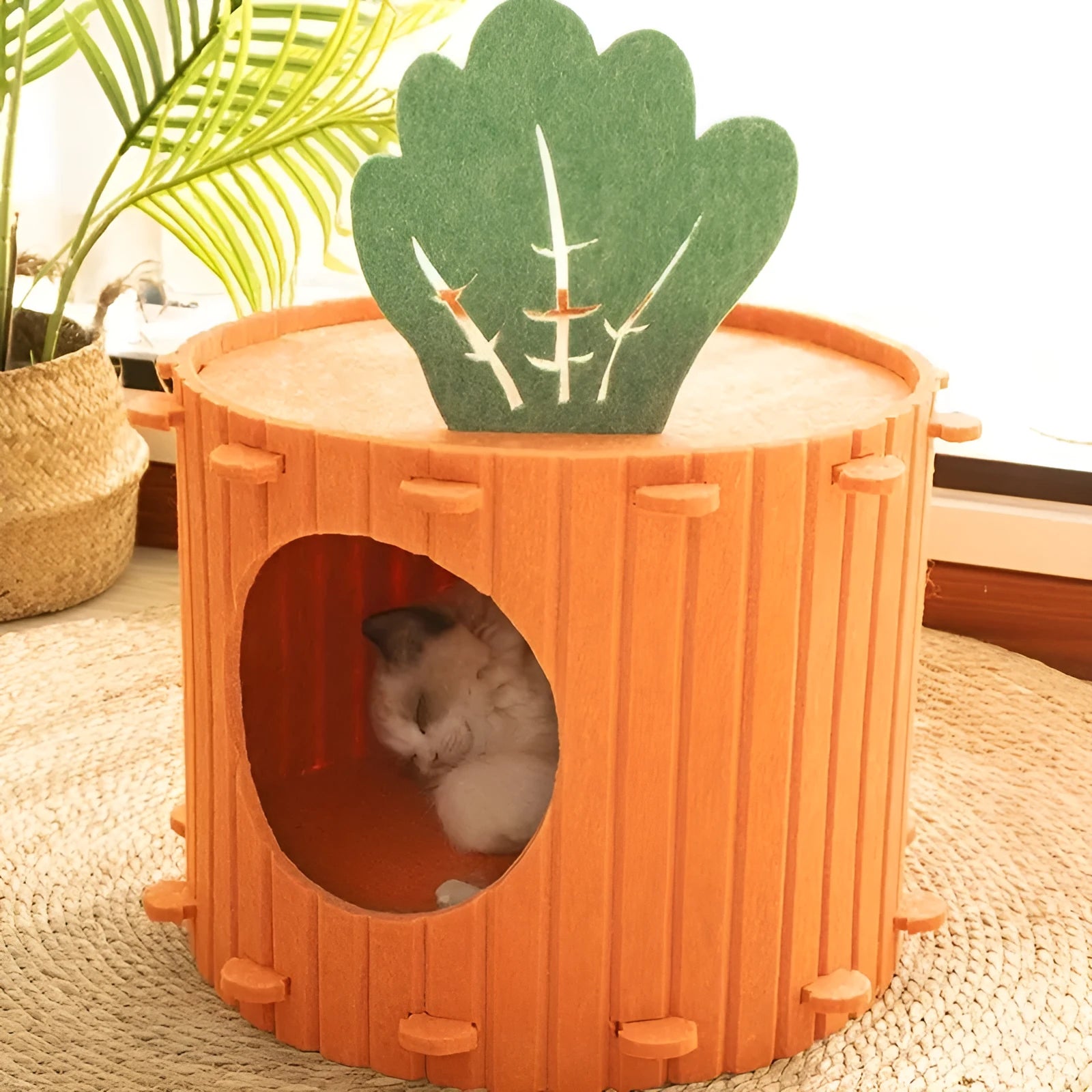 A soft grey felt cat tunnel nest shaped like a carrot, shown in a semi-enclosed tunnel design.