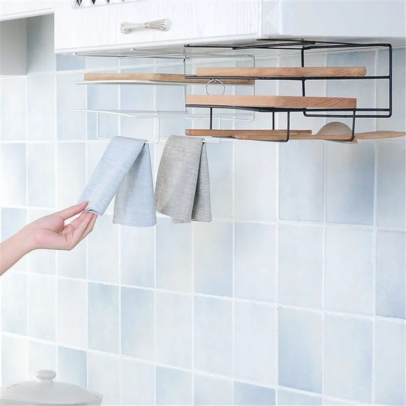Double-layer iron kitchen storage rack holding towels and chopping board, black finish, wall mounted
