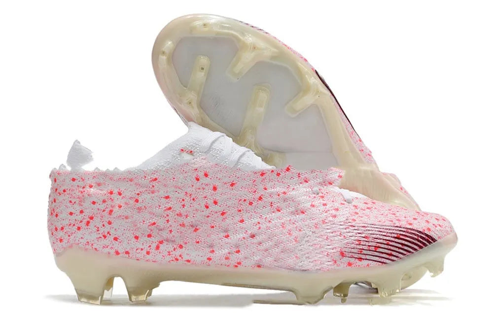 Men's football shoes with knitted upper, FG studs, and air cushion for firm ground surfaces